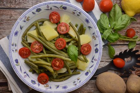 fresh salad with green beans tomatoes and potatoesの写真素材