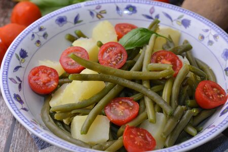 fresh salad with green beans tomatoes and potatoesの写真素材