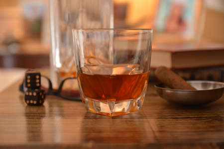Glass of cognac with cigar in a barの写真素材