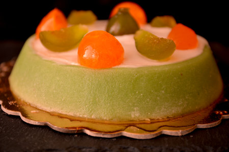 Sicilian cassata typical Italian dessert with ricotta cheese marzipan pieces of chocolate candied fruitの写真素材