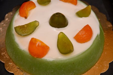 Sicilian cassata typical Italian dessert with ricotta cheese marzipan pieces of chocolate candied fruitの写真素材