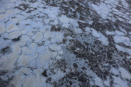 Old weathered cement floor with cracks and damages.の写真素材