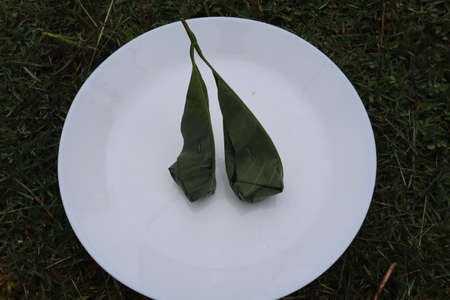 Malay Traditional Dessert- Fermented Glutinous Rice in Rubber Leafの写真素材