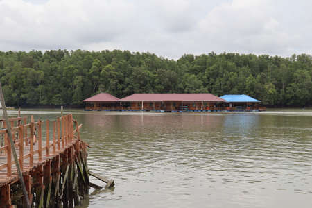 Jetty, boat house and riverの写真素材