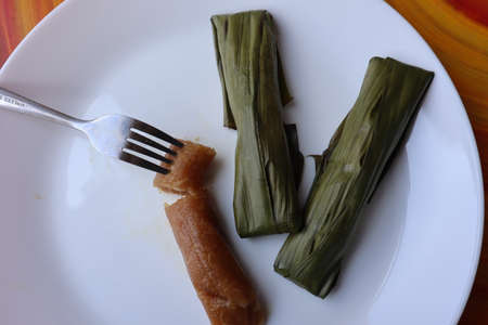 Traditional Malaysian and Indonesian desserts, steamed tapioca mixed with coconut âLepat Ubiâの写真素材