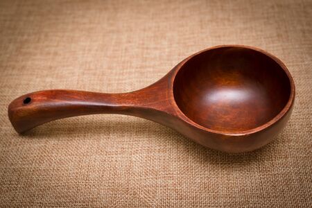wooden spoon on sack clothの写真素材