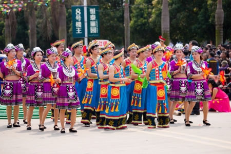 Nanning, China - March 24, 2012: Chinese dancing people in Zhuang ethnic Festival.March 3rd is the Songs Festival of the Zhuang ethnic in Southwest China.Every year in this day,Zhuang ethnic people with traditional dress singing and dancing to celebrate tのeditorial素材