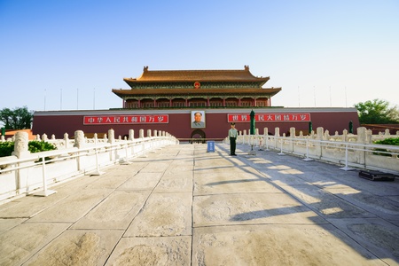 Beijing, China - May 30, 2012: a Chinese soldier in front of the Tiananmen Gate of Heavenly Peace.Tiananmen Gate in Beijing,China.It was built in 1420,Now it become a very famous tourist attraction,thousands of tourist visit the Tiananmen Gate all around のeditorial素材