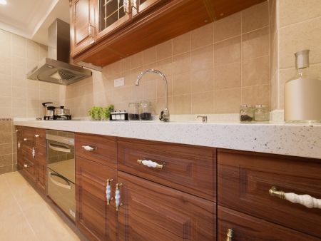 the kitchen with classic cabinet