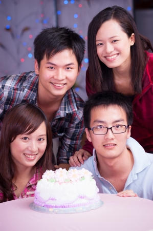 young asian friends at birthday partyの写真素材