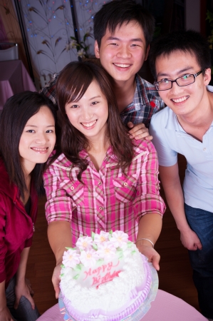 young asian friends at birthday partyの写真素材