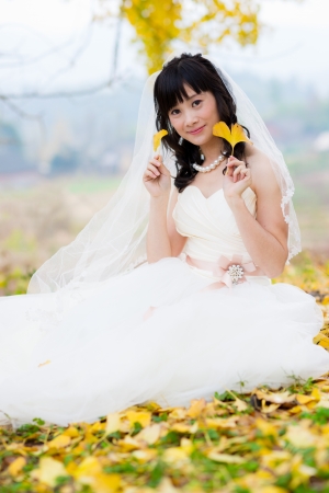 happiness bride in ginkgo forestの写真素材