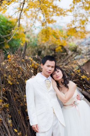 happiness groom and bride in ginkgo forest,just marriedの写真素材