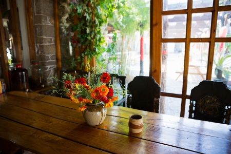 colorful flowers on a wooden tableの写真素材
