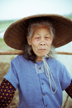 Chinese peasant working on the rice fieldの写真素材
