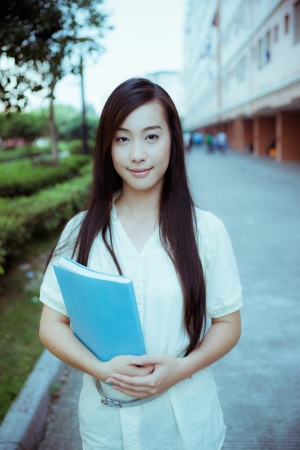 Chinese female college student in the schoolの写真素材