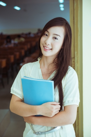 Chinese female college student in the schoolの写真素材