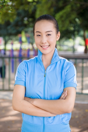 smiling Chinese college student with sport outfitの写真素材