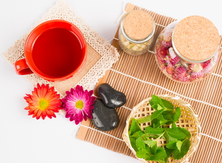 hot tea,flowers,mint on white backgroundの写真素材