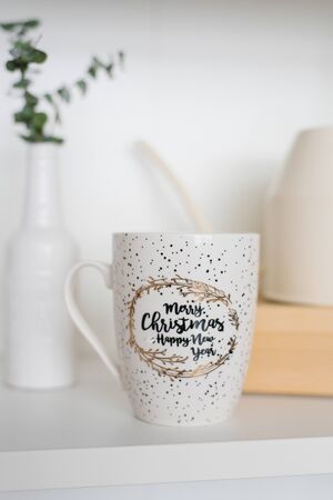 Beautiful stylish mug for tea or coffee on a shelf in the living room or dining roomの写真素材