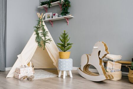 Children's room with toys, wigwam, horse. christmas decorの写真素材
