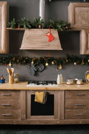 Decorated for Christmas and New Year wooden kitchen in the houseの写真素材