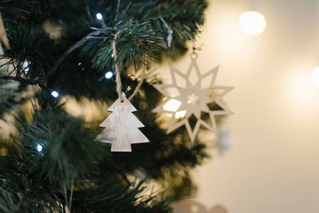 Wooden Christmas tree toy with lightsの写真素材