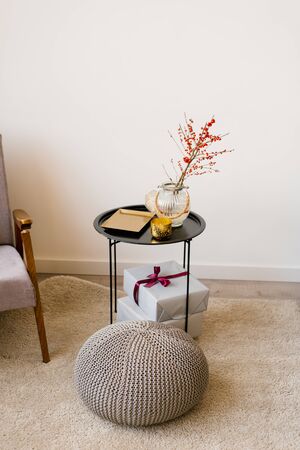 Coffee table in the decor of the living room in the house. Gift gets on the tableの写真素材