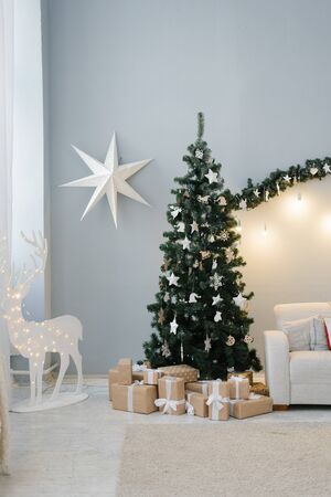 Traditional Christmas tree in the living room in pastel colorsの写真素材