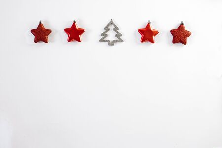 Christmas border-red Christmas stars Christmas tree toys and Christmas tree on white background, horizontal banner. Greeting card for Christmas or New Year. Copy spaceの写真素材