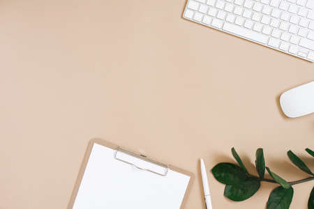Minimalistic flat lay. Desktop of a blogger or freelancer. Work from home. Frame of office supplies...