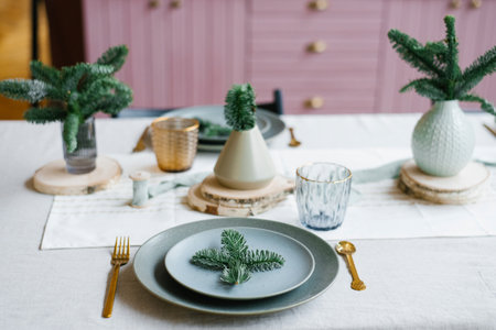 Table setting with festive decorations. Preparing for Christmas or new year's dinner