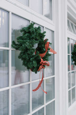 Front door with a Christmas wreath and bows. Home decorの写真素材
