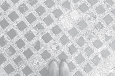 Color of the Year 2021 Ultimate Gray. glass tiles embedded in asphalt and rshoes. Original background for copy space.の写真素材