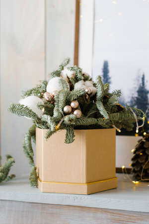 Fir branches and Christmas balls in a box. Christmas fir compositionの写真素材