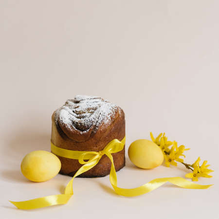 Easter cake and bright yellow painted eggs, yellow forsythia flowers, festive composition, Russian Orthodox tradition, selective focusの写真素材