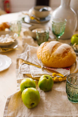 Green apples, homemade fresh wheat bread. Serving breakfast at home
