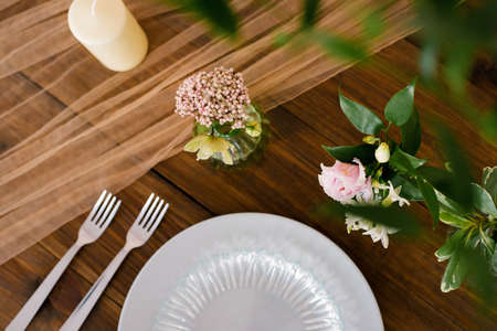 Festive wedding, festive table setting with silver cutlery, tulle ribbon, eucalyptus branches, eustoma and hyacinthas flowers. The concept of the restaurant menu. Flat lay, top viewの写真素材
