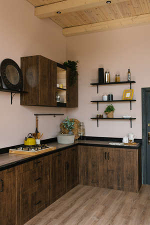 Wooden kitchen with a beautiful decor and a stone sink and a vintage mixerの写真素材