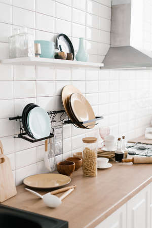 Kitchen utensils are on the cabinet. The interior of the room in the Scandinavian style
