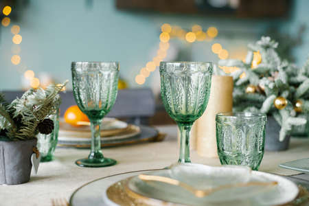 Green glass glasses for a festive Christmas dinnerの写真素材