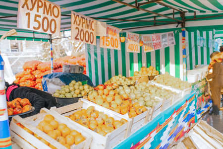 Tashkent, Uzbekistan. December 2016. Fruit vendor at Chorsu Marketのeditorial素材