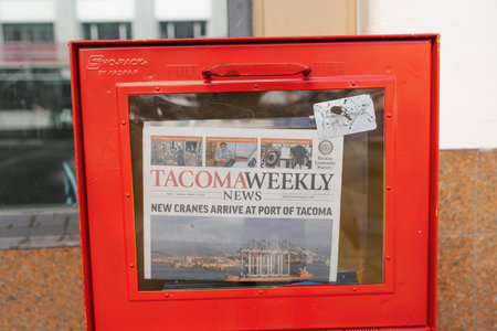 Tacoma, Washington, USA. March 2021. Tacoma Weekly newspaper in the red box