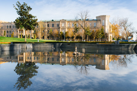 Tashkent, Uzbekistan. November 2021. The building near the Amir Timur Square is reflected in the water surfaceのeditorial素材