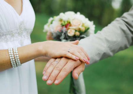 Palms of husband and wife, newlywed. Wedding ring on your finger. Valentine's dayの写真素材