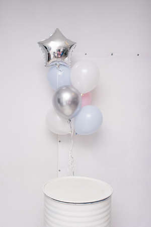Delicate blue, pink and silver helium balloons on holidayの写真素材