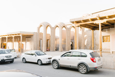 Bukhara, Uzbekistan. March 2022. White passenger cars on the streets of the old cityのeditorial素材