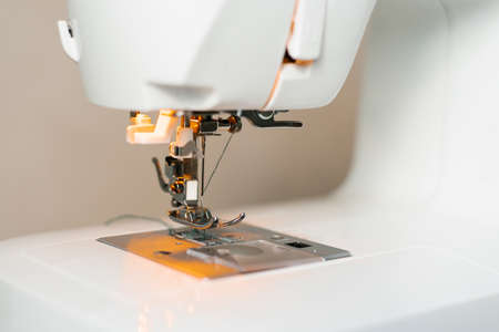 Close-up of sewing machine parts, needle and threadの写真素材