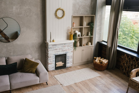 Scandinavian living room in gray tones. Interior of a country house with fireplace and sofaの写真素材