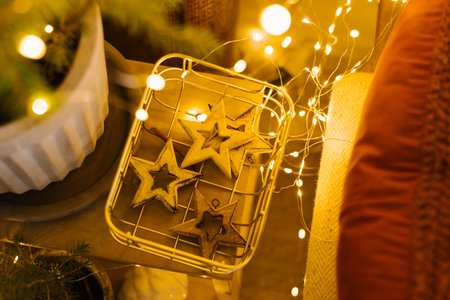 Christmas tree toys wooden stars in a basket with lights